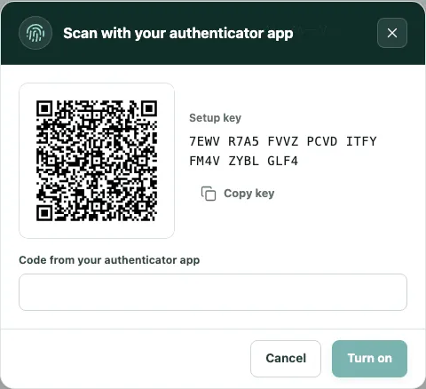 The Scan with your authenticator app window, with the QR code, the setup key and the code field